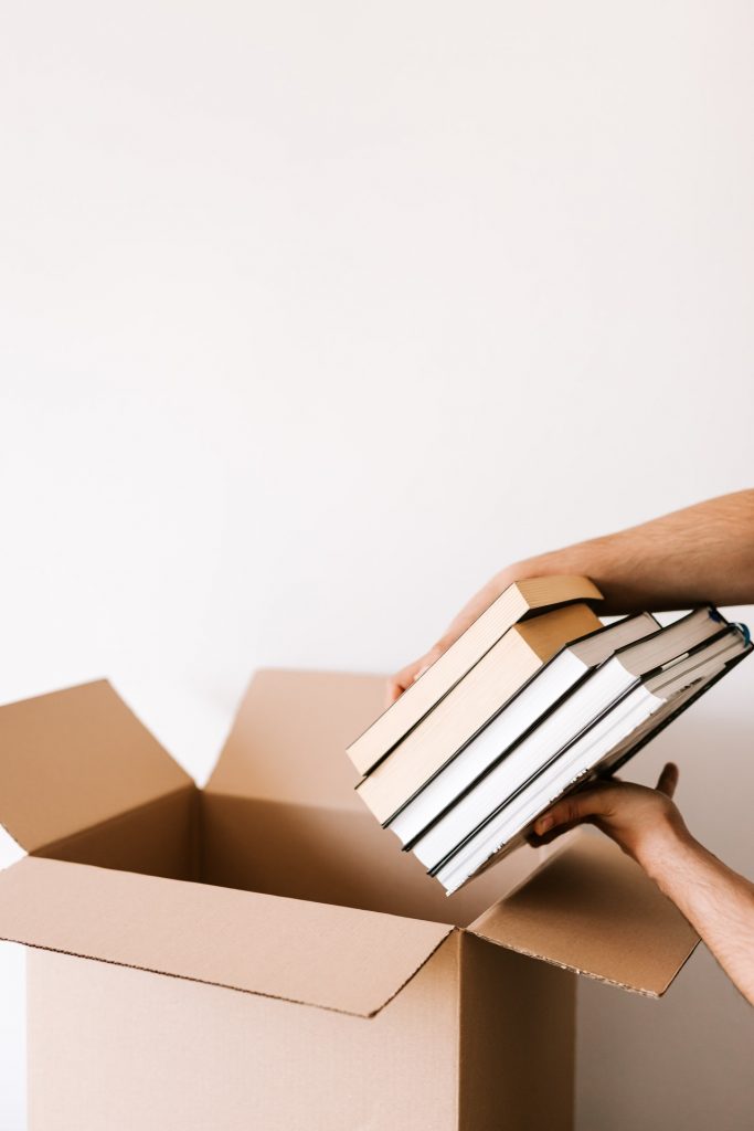 putting books into a moving box